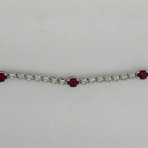 Sterling Silver Lab Grown 1.40ct Oval Ruby And .09ct Natural Diamond Bracelet - 001-240-00040