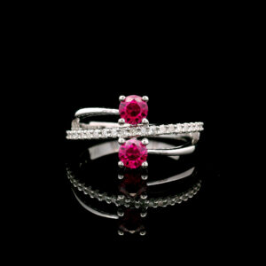 10K White Gold Two-Stone 4mm Created Ruby Crossover Ring w/ 0.125CTW Lab Grown Diamond Accents