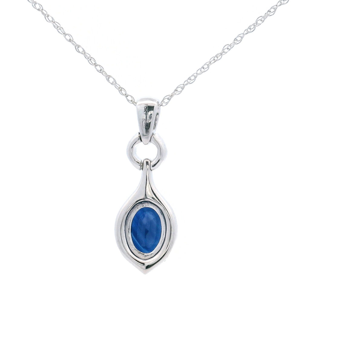 Elegant 10k white gold pendant with oval 7x5 blue sapphire and 1/6 diamond halo tw accents. - Image 3